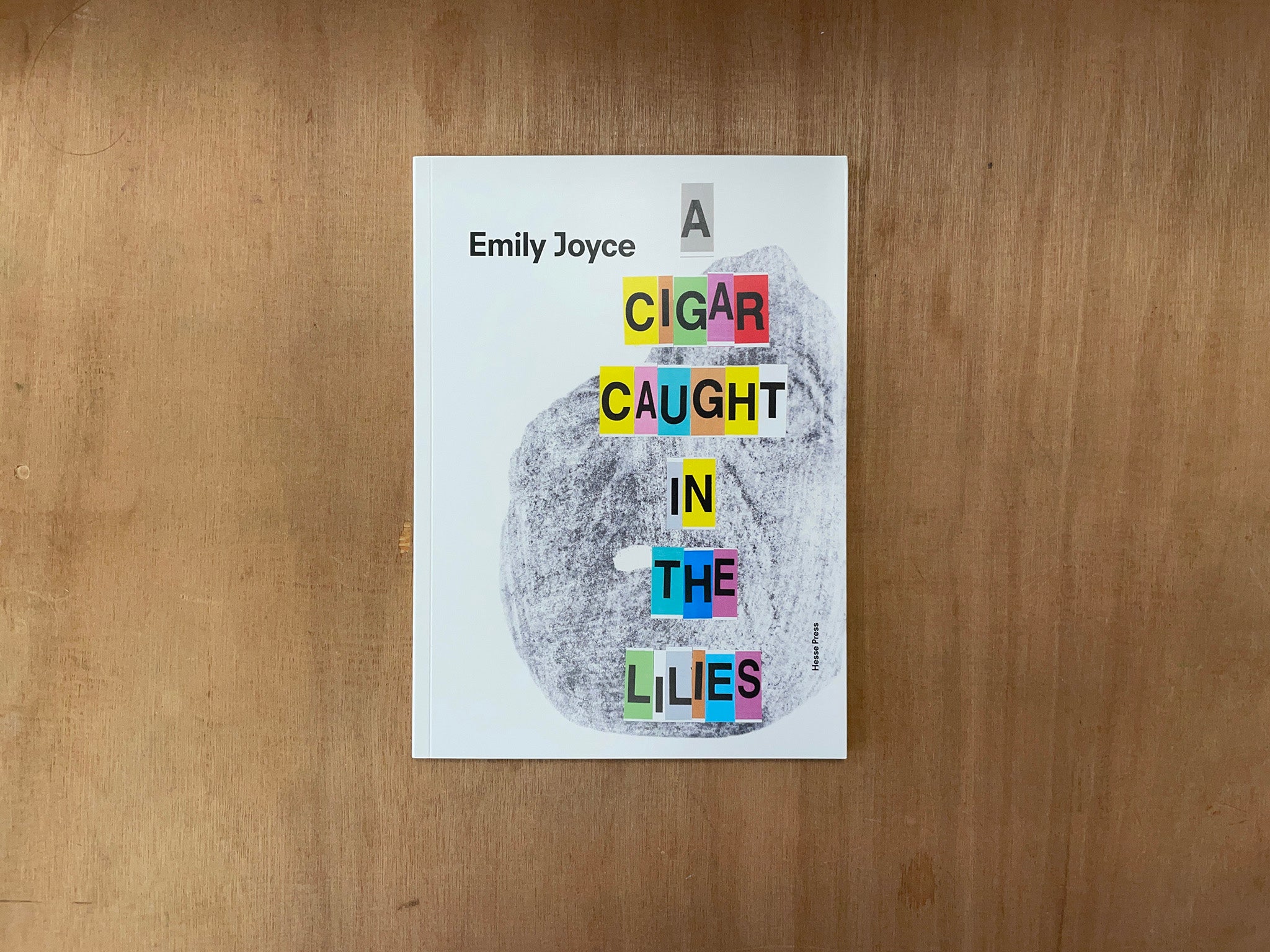 A CIGAR CAUGHT IN THE LILIES by Emily Joyce